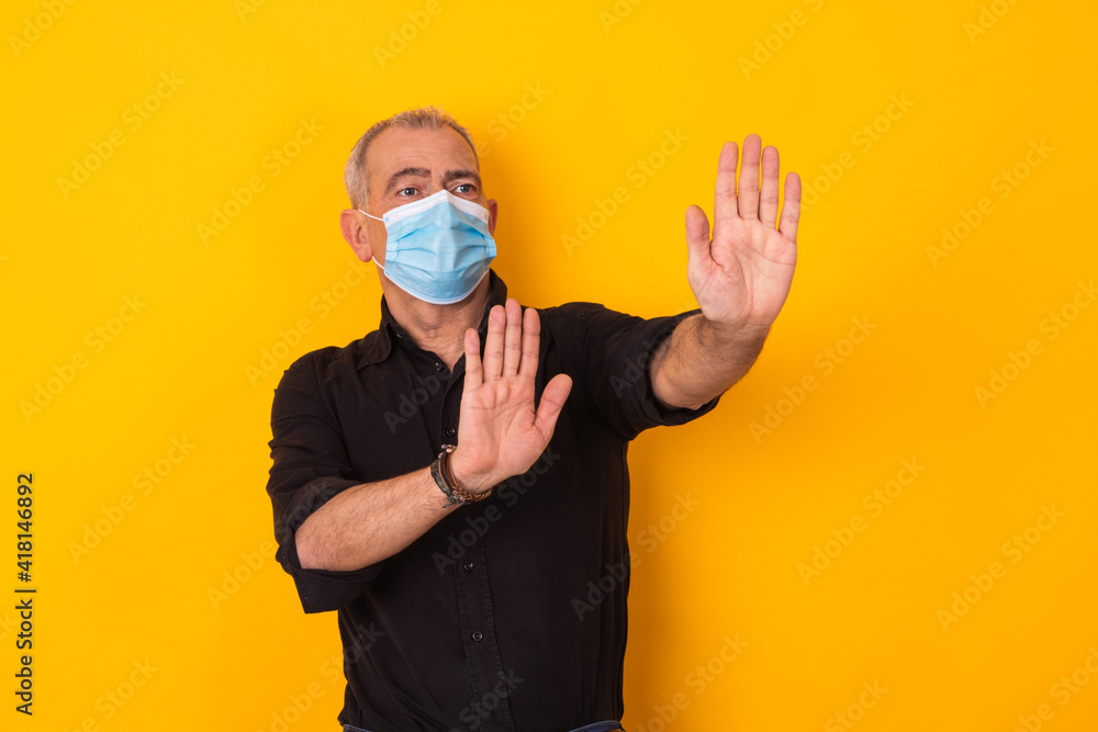 adult man with mask isolated with stop expression