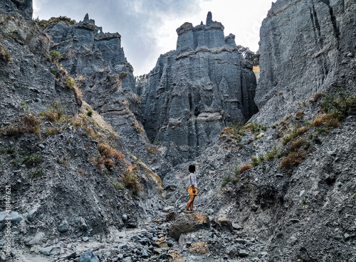 Black woman standing in the middle of the Pinnacles in New Zealand