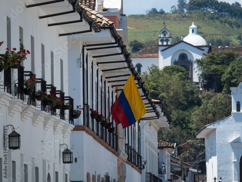 Colombian national flag on white wall exterior facade colonial historic old building architecture Popayan Cauca Colombia