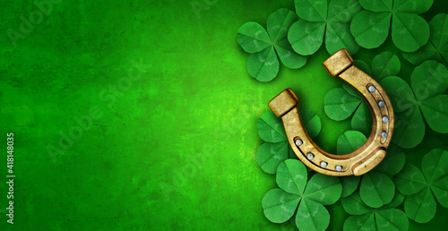 Saint Patricks Day lucky charms as green shamrock and a horse shoe as a clover leaf background as a St Patrick celebration symbol and seasonal spring icon of Irish tradition celebration