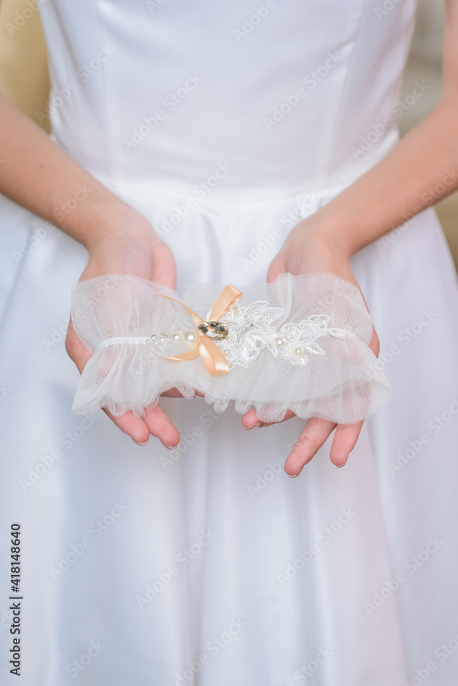 Bride in a white dress is holding a beautiful bright bridal bouquet. Bride in a white dress is holding a beautiful bright bridal bouquet.