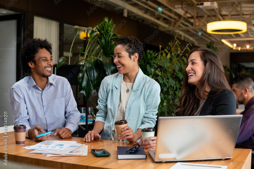 © Vergani Fotografia - business teammates talking causally in the office. . © Vergani Fotografia - business teammates talking causally in the office. .