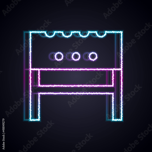 Glowing neon line BBQ brazier icon isolated on black background. Vector.
