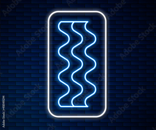 Glowing neon line Bacon stripe icon isolated on brick wall background. Vector.