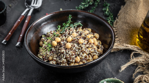 quinoa with chickpeas. Super food, Food recipe background. Delicious breakfast or snack on a dark background, top view