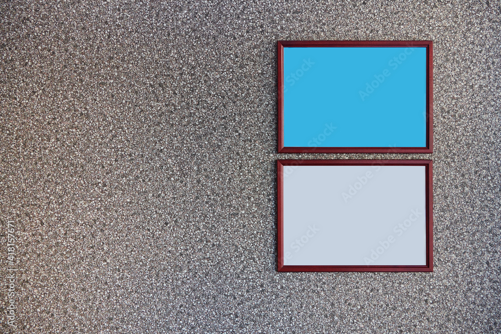 Fototapeta premium Two brown wooden frame mockup in landscape orientation on the textured wall