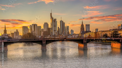 The skyline of Frankfurt at sunset, seen from a bridge at the river Main at a cold day in winter. © ms_pics_and_more