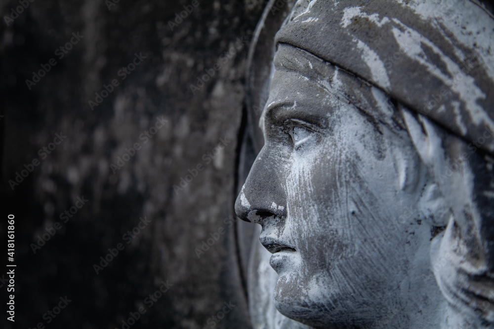 Virgin Mary. Fragment of ancient statue. Religion, faith, Christianity concept. Horizontal image.