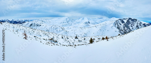 Panorama of cloudy Feuerkogel mountain plateau, Salzkammergut, Austria photo