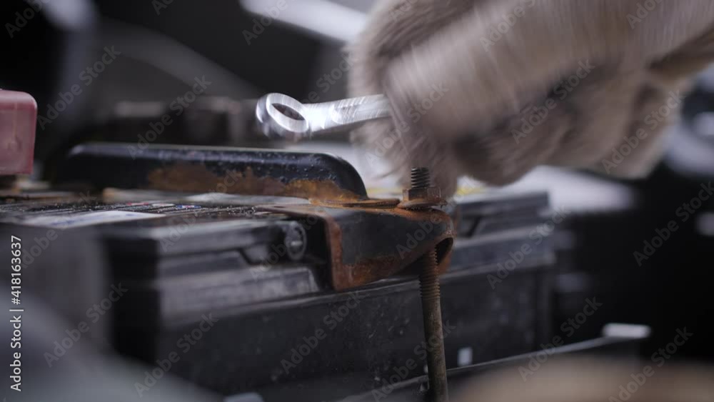 Close up shot mechanic hands using fix wrench to repair the car Close up shot mechanic hands using fix wrench to repair the car
