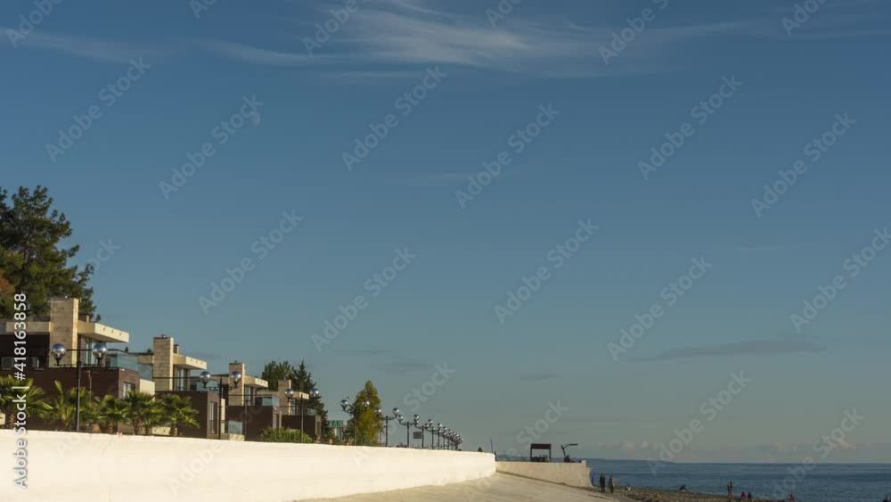 Tourists walk on the Sochi embankment Tourists walk on the Sochi embankment