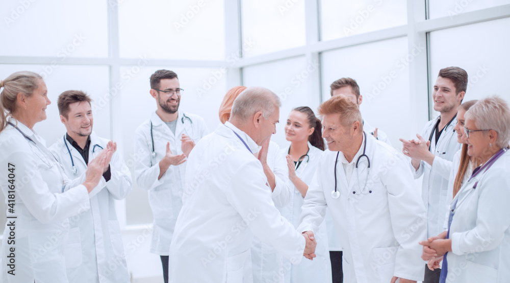 group of medical colleagues discussing their achievements. group of medical colleagues discussing their achievements.