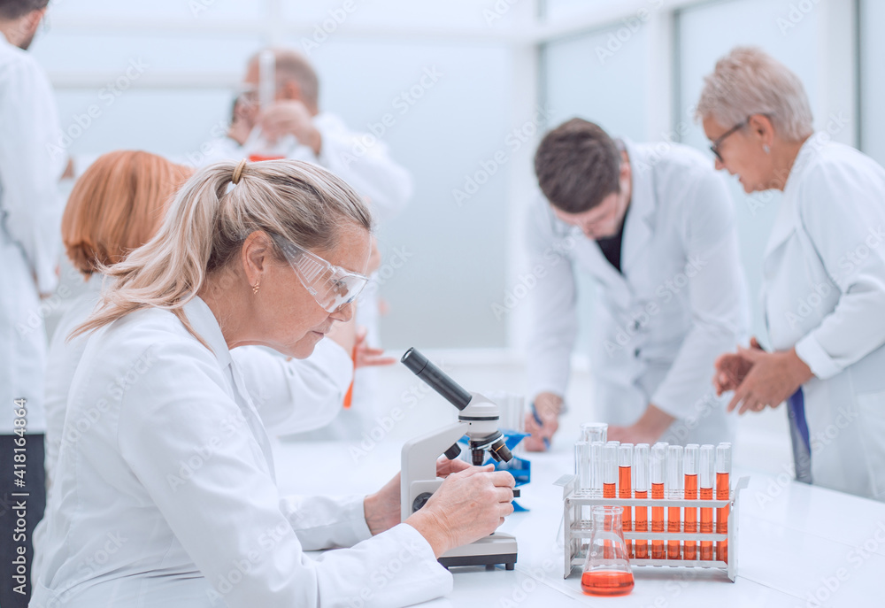 close up. female scientist conducts blood tests. close up. female scientist conducts blood tests.