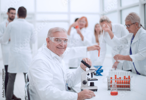smiling scientist at the workplace in the laboratory.