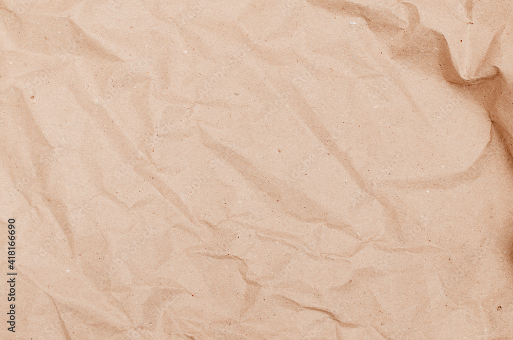 textural background. Rumpled brown cardboard paper texture textural background. Rumpled brown cardboard paper texture