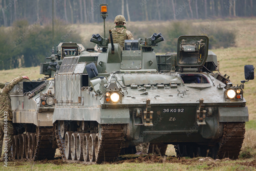 british army FV512 warrior MRV preparing to tow a stricken warrior FV510 light infantry fighting vehicle tank on Salisbury Plain, Wiltshire british army FV512 warrior MRV preparing to tow a stricken warrior FV510 light infantry fighting vehicle tank on Salisbury Plain, Wiltshire