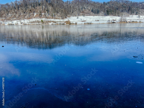 A black frozen lake