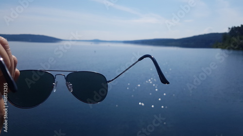 sunglasses on the lake