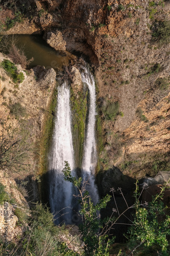 Aerial view of Hatanur waterfall as seen from upper Ayun stream trail in Nahal Ayun nature reserve, near the town of Metula in Upper Galilee, Northern Israel, Israel.