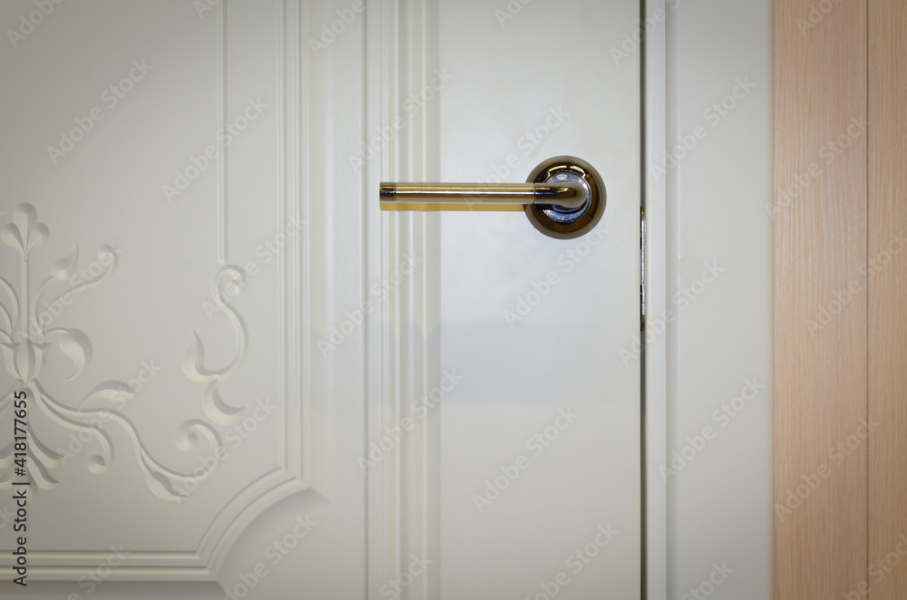 White door to the room in the evening light. White door to the room in the evening light.