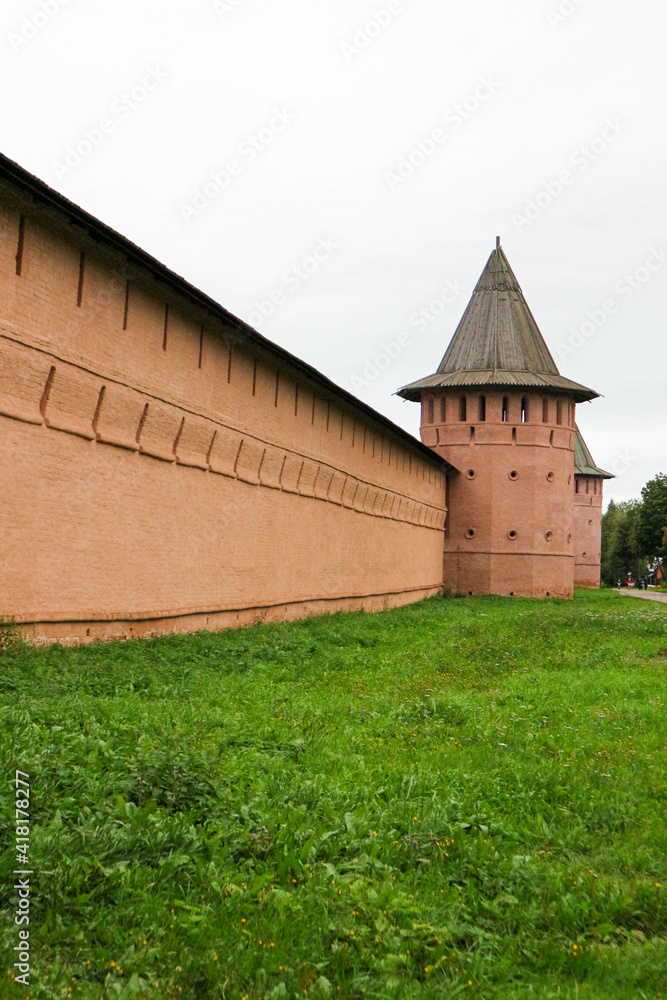 red brick wall and tower of Saviour Monastery of St. Euthymius in Suzdal, Russia