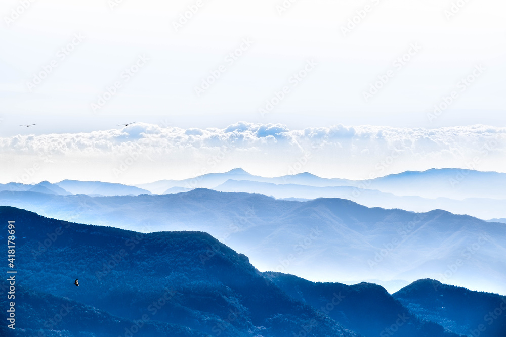 Background blue foggy view of the mountains