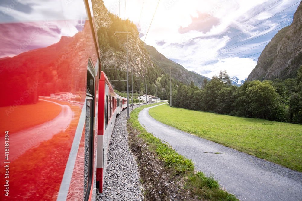 Fototapet Panoramic view of alpine mountains from swiss train