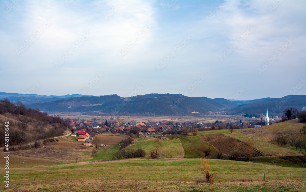 Fototapeta premium landscape with a village between the hills