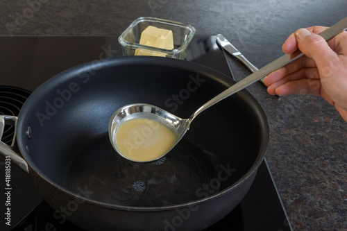 pan and ladle with batter © AndreaR