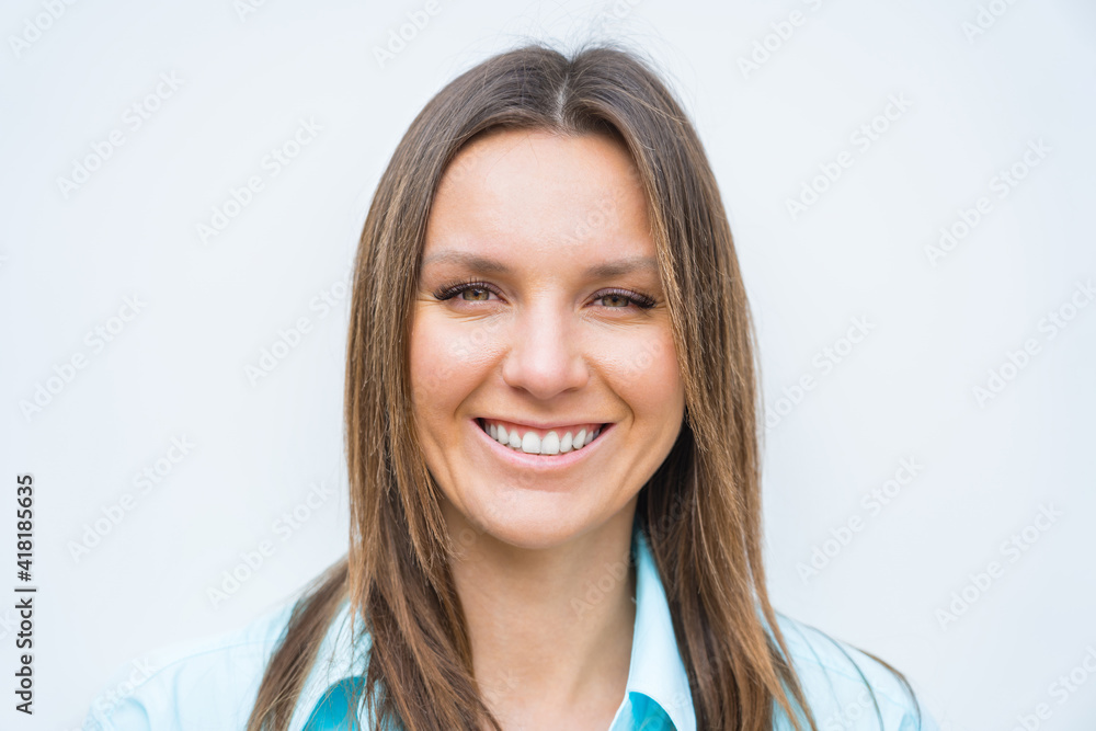 Close up portrait of young attractive happy smiling business woman with white perfect smile looking at the camera. Positive concept. Close up portrait of young attractive happy smiling business woman with white perfect smile looking at the camera. Positive concept.