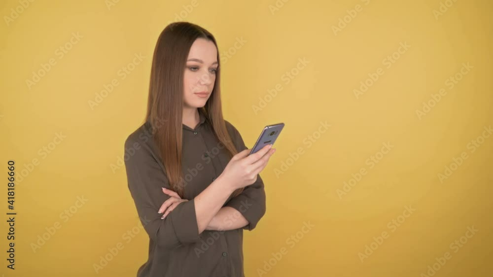 Young business woman looks into the phone with a calm face. 4K Young business woman looks into the phone with a calm face. 4K