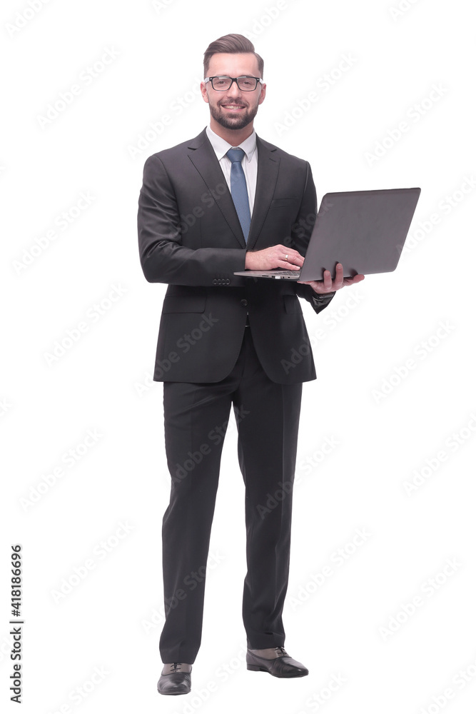 in full growth. businessman with open laptop. in full growth. businessman with open laptop.