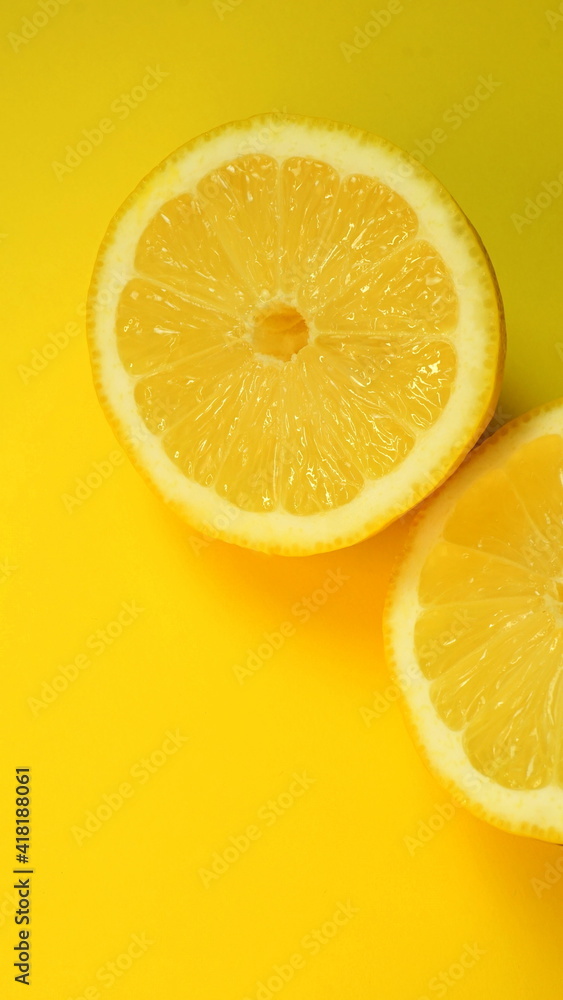 Half of the cut lemon isolated on yellow Half of the cut lemon isolated on yellow