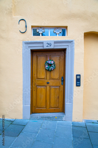 a crooked wooden door in an old European town