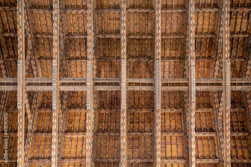 medieval era painted wood beams supporting a ceiling
