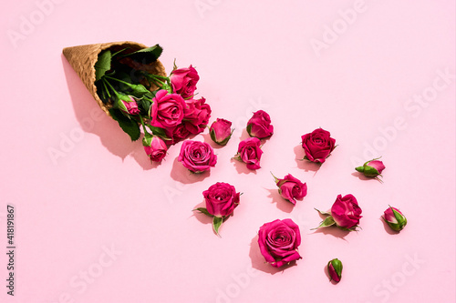 Roses lying near a beautiful bouquet on March 8 photo