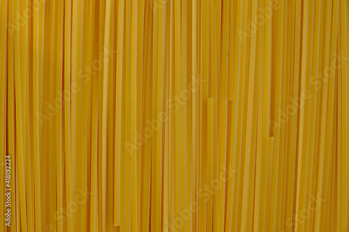 Background with long yellow pasta