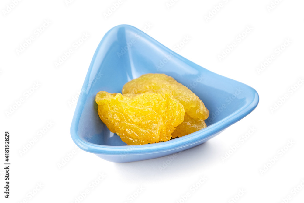 Dried pear fruits in blue bowl isolated on white background Dried pear fruits in blue bowl isolated on white background