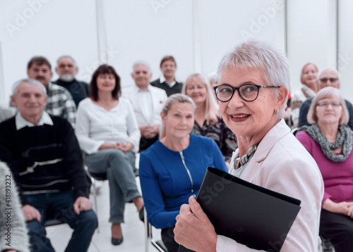 Businesswoman addressing colleagues at office meeting