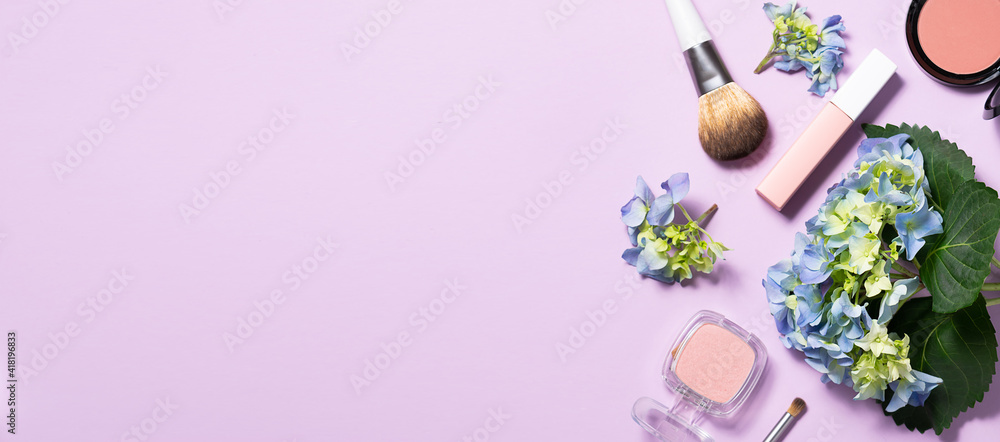 Creative composition with fresh hydrangea flowers and decorative cosmetic products on light lilac background top view. Spring cosmetic sale banner.