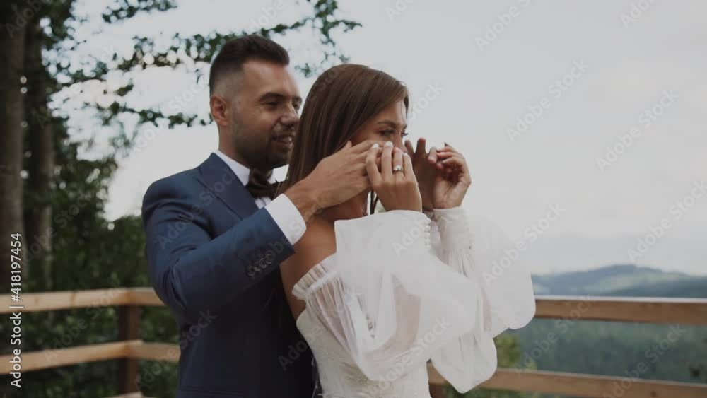 Bride and groom embracing in wedding day.Lovely newlyweds hugging and kissing Bride and groom embracing in wedding day.Lovely newlyweds hugging and kissing