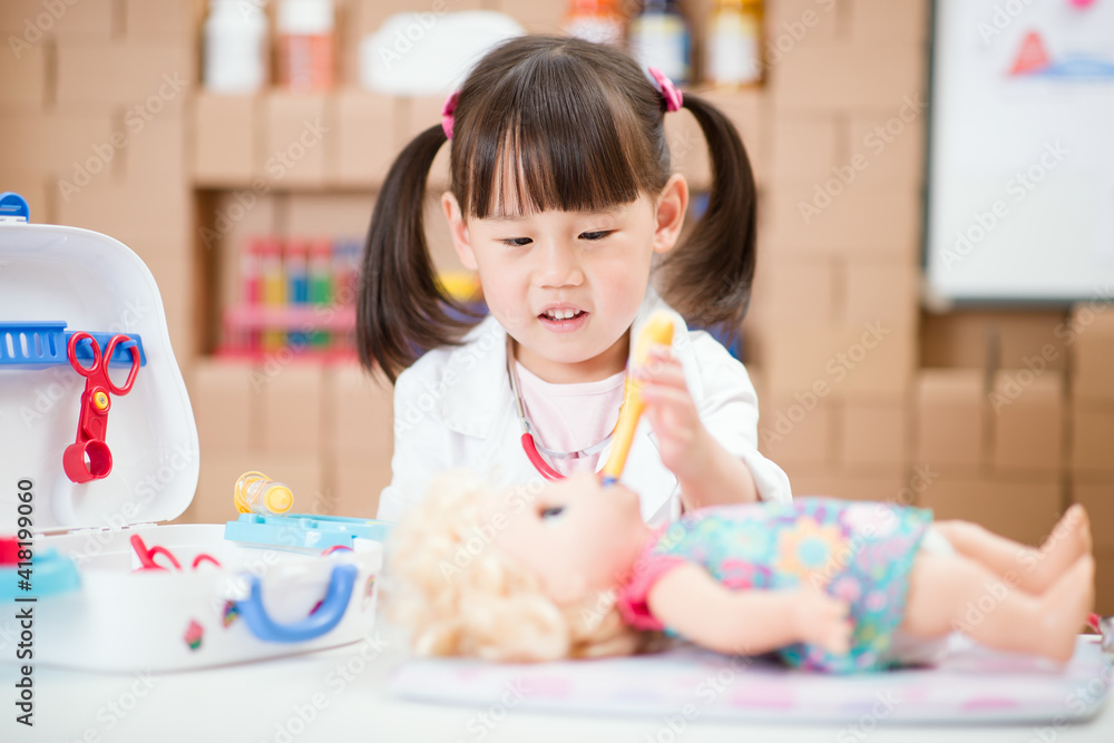 young girl pretend play doctor role at home young girl pretend play doctor role at home