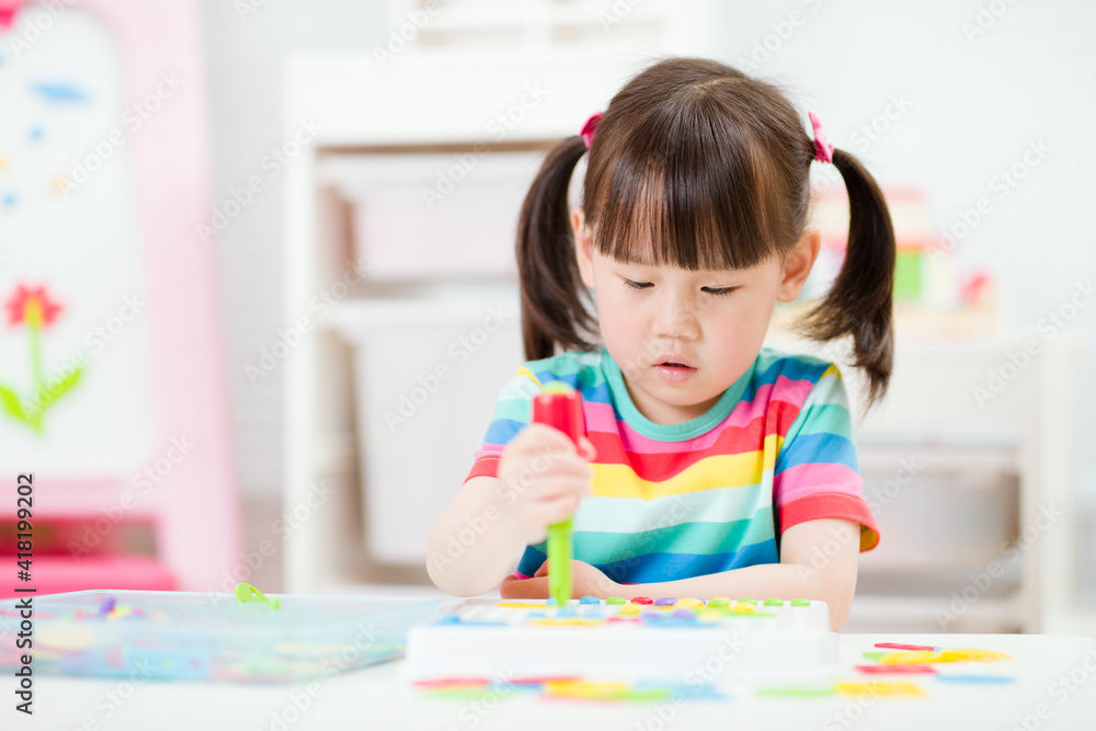 young girl playing creative toy blocks for homeschooling young girl playing creative toy blocks for homeschooling