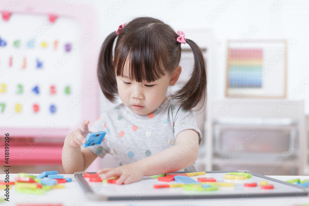 young girl playing creative toy blocks for homeschooling young girl playing creative toy blocks for homeschooling
