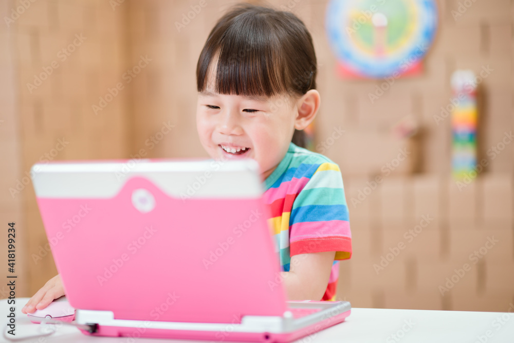 young girl using laptop for online learning during lockdown time young girl using laptop for online learning during lockdown time