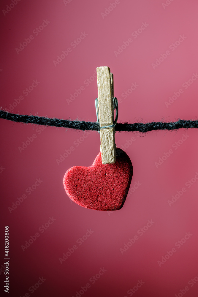 miniature red hearth hanging on clothespins with miniature wood clips miniature red hearth hanging on clothespins with miniature wood clips