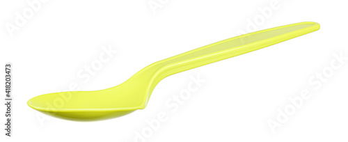 Green spoon made of biodegradable materials close-up isolated on white background