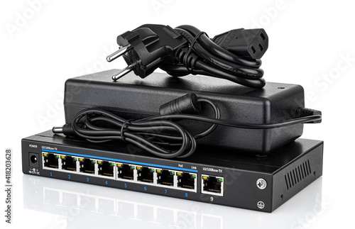 8 PoE ports ethernet switch and power supply with EU plug isolated on white background
