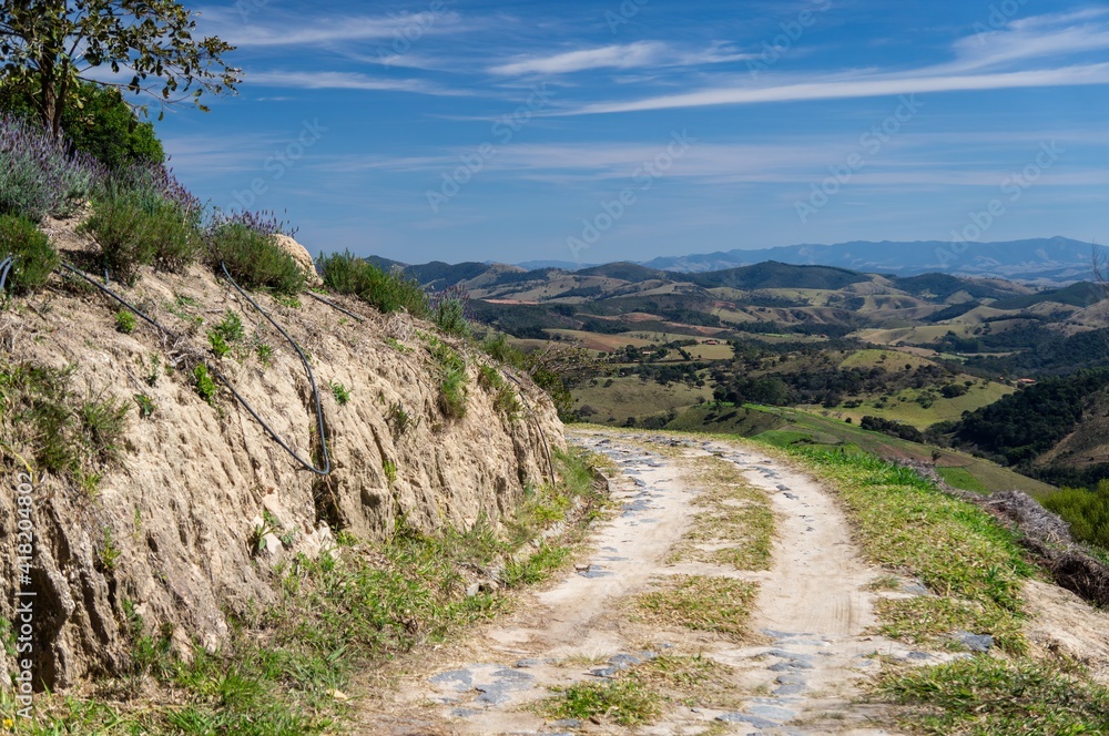 The curved dirt road at the lower section of 