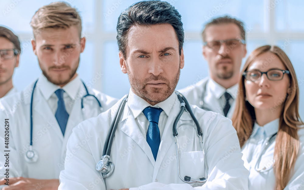 portrait of doctor and medical staff standing in the office portrait of doctor and medical staff standing in the office